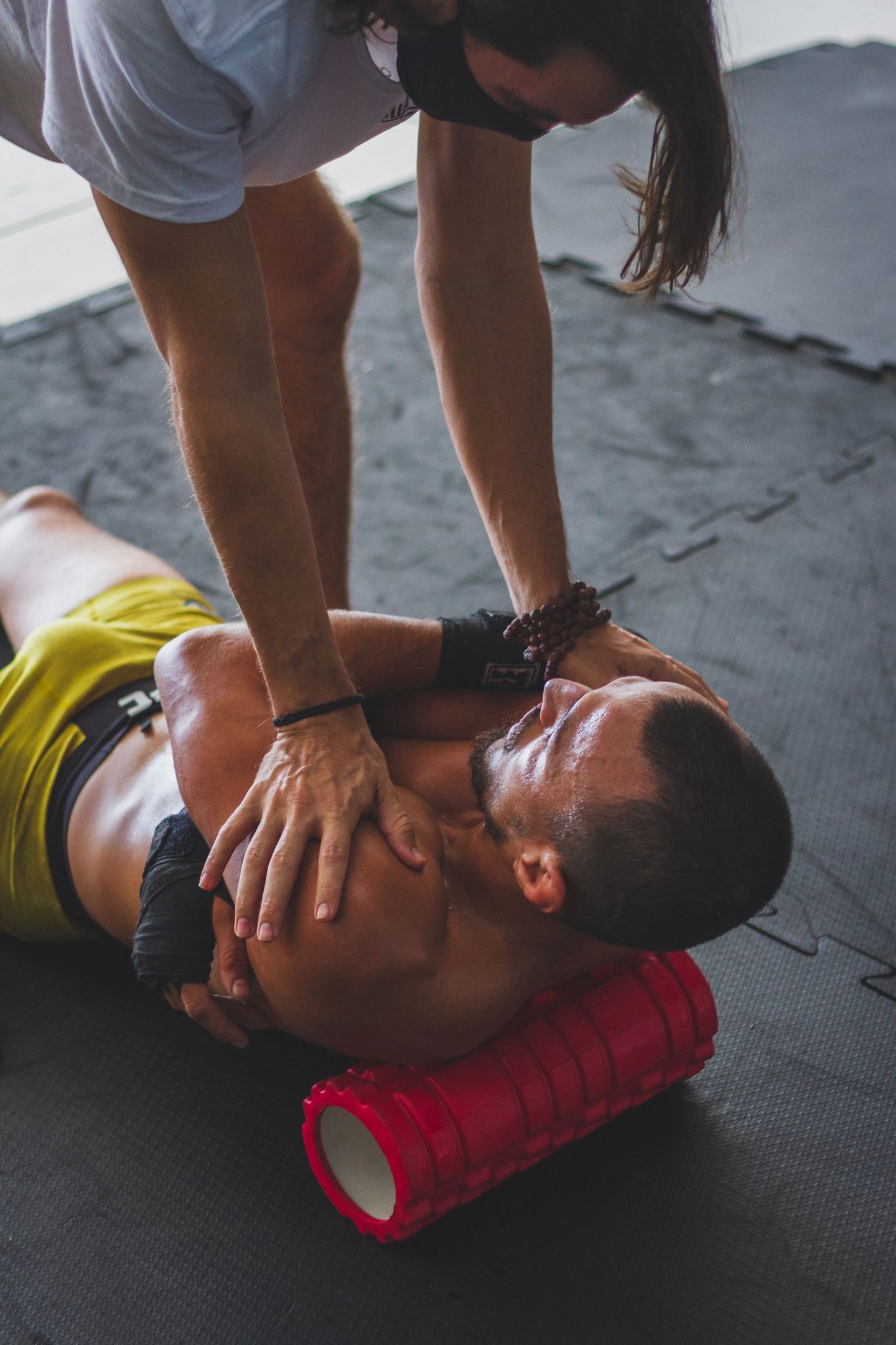 Athlete using a foam roller for muscle stretc