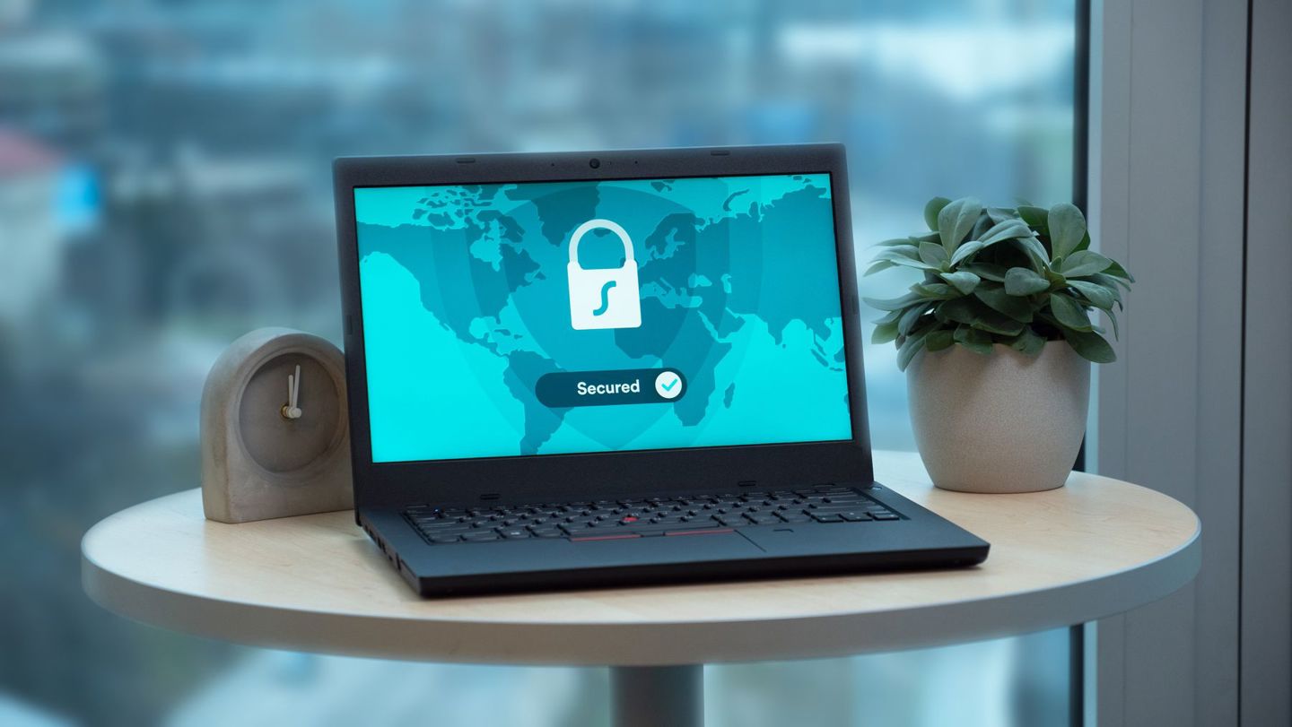 Laptop displaying a security lock icon on a t