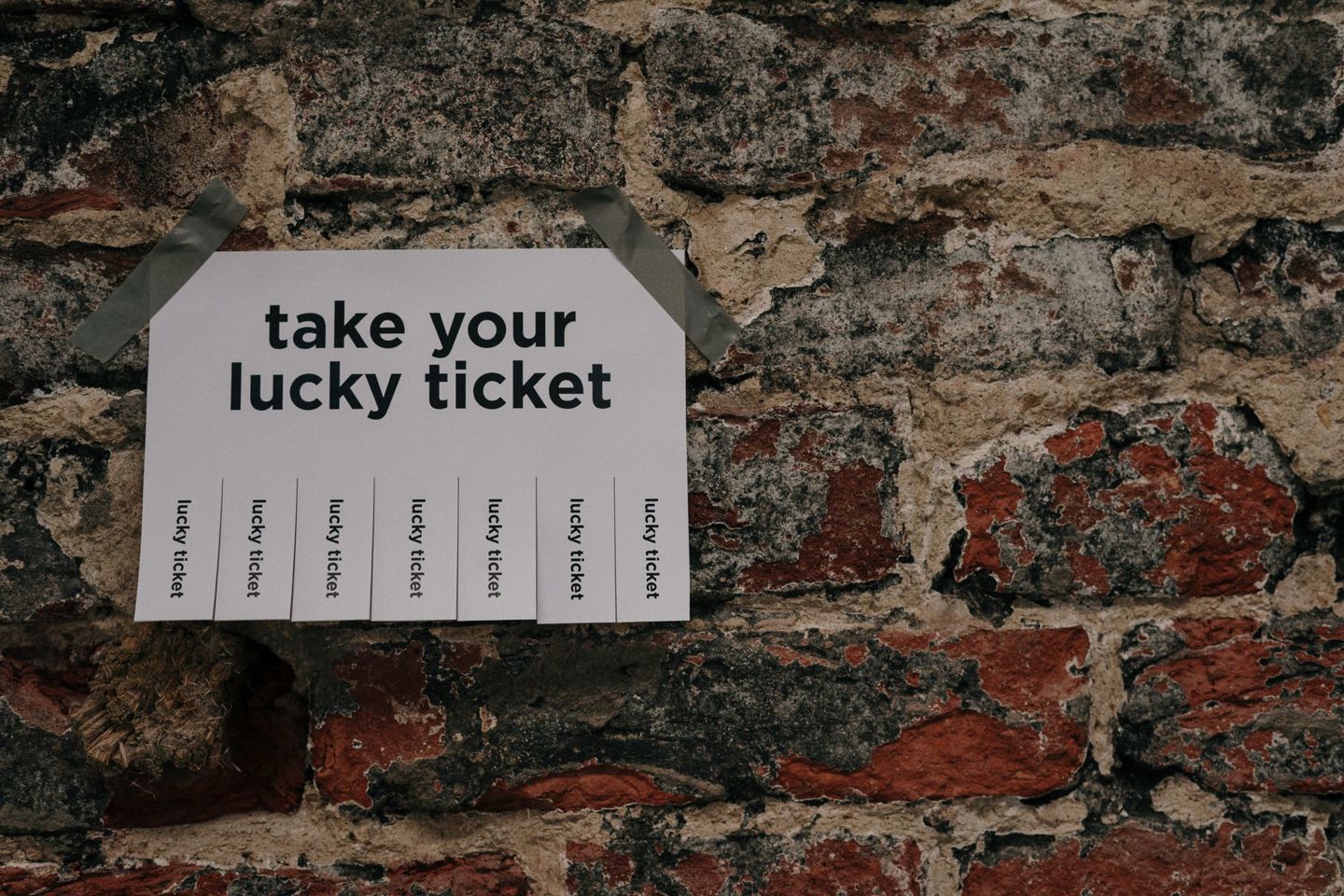 Close-up of a 'Take Your Lucky Ticket' sign t