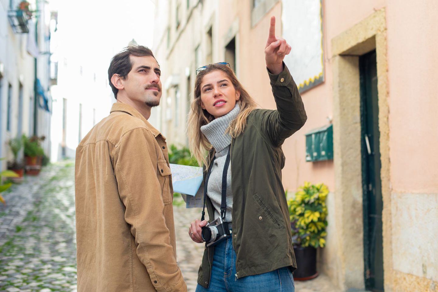 Young Couple Navigating A European Street Wit