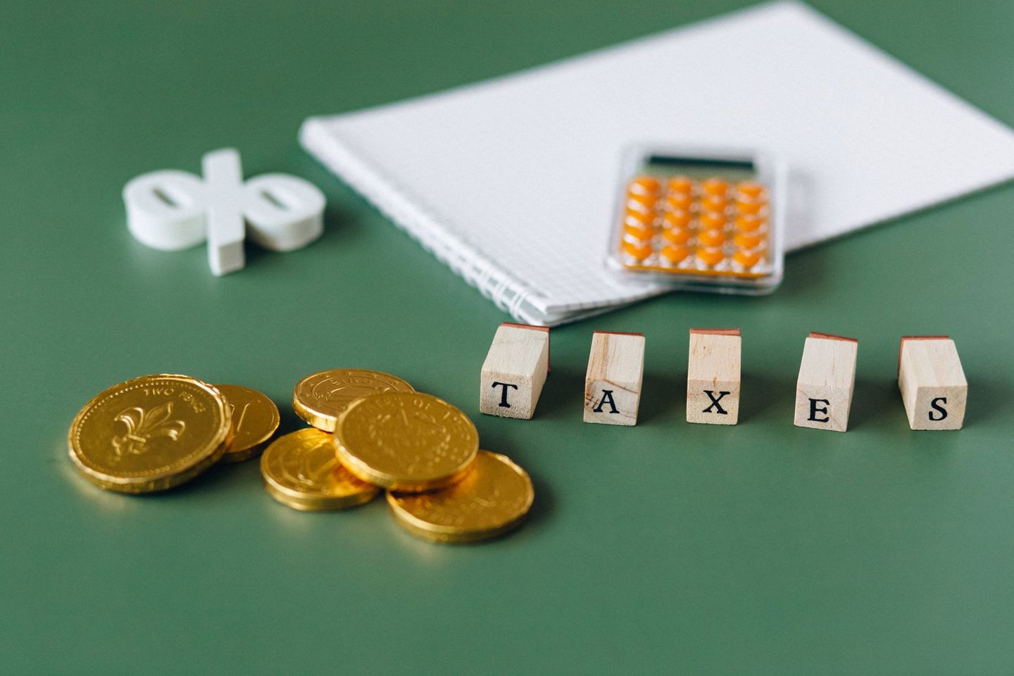 Close-up of tax-related items including coins