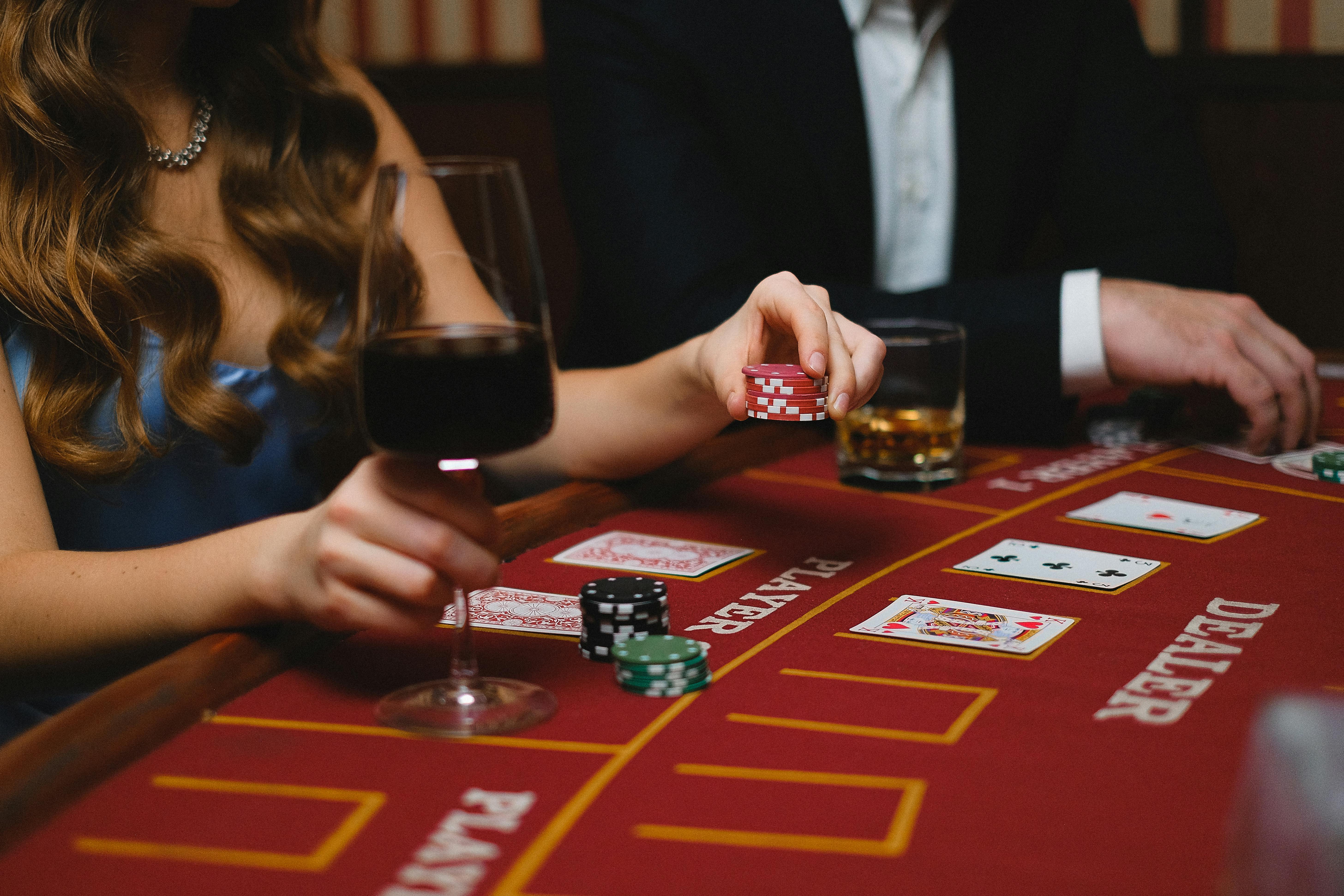 a close up of a woman and a man at a casino table