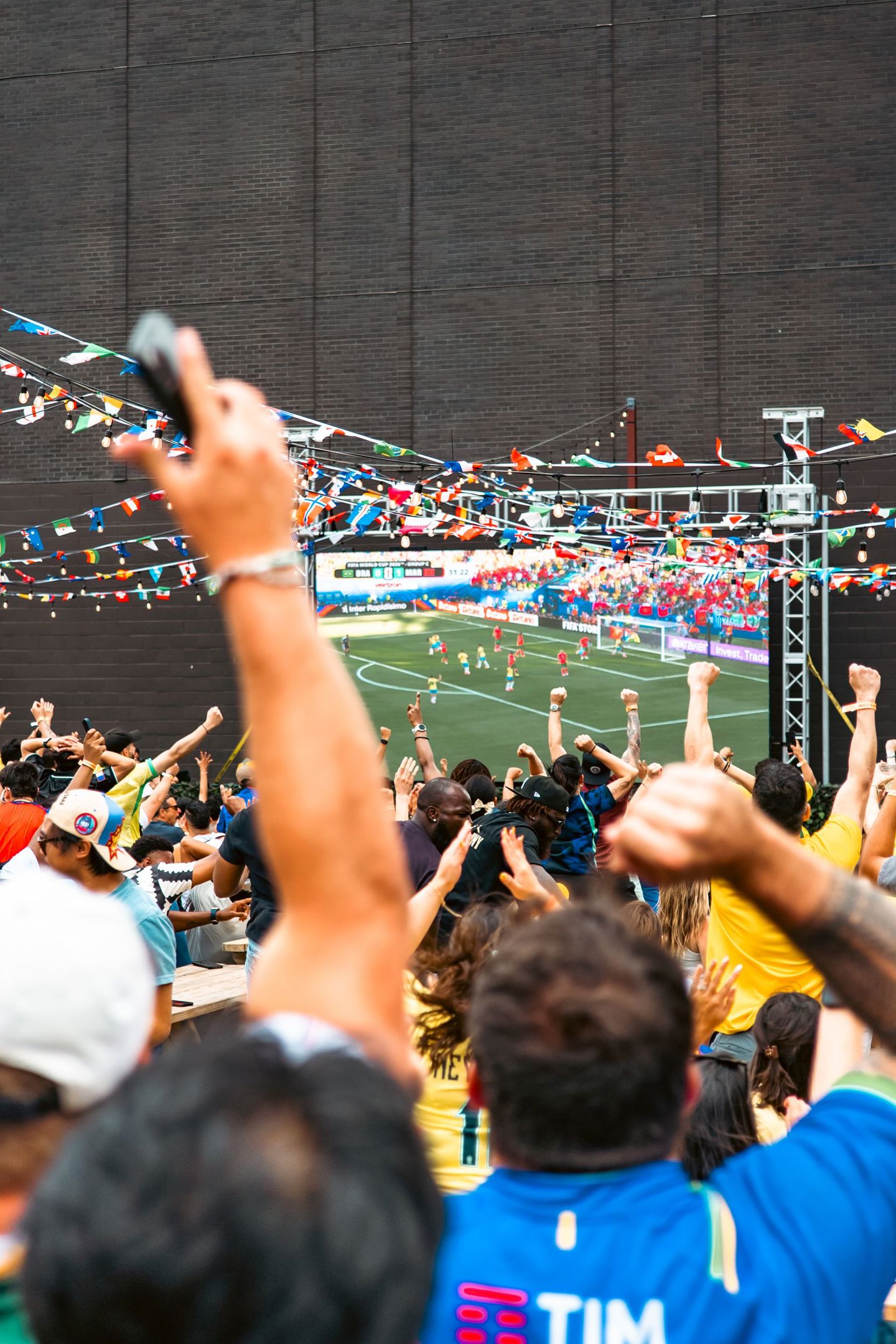 A vibrant crowd cheerfully watching a soccer