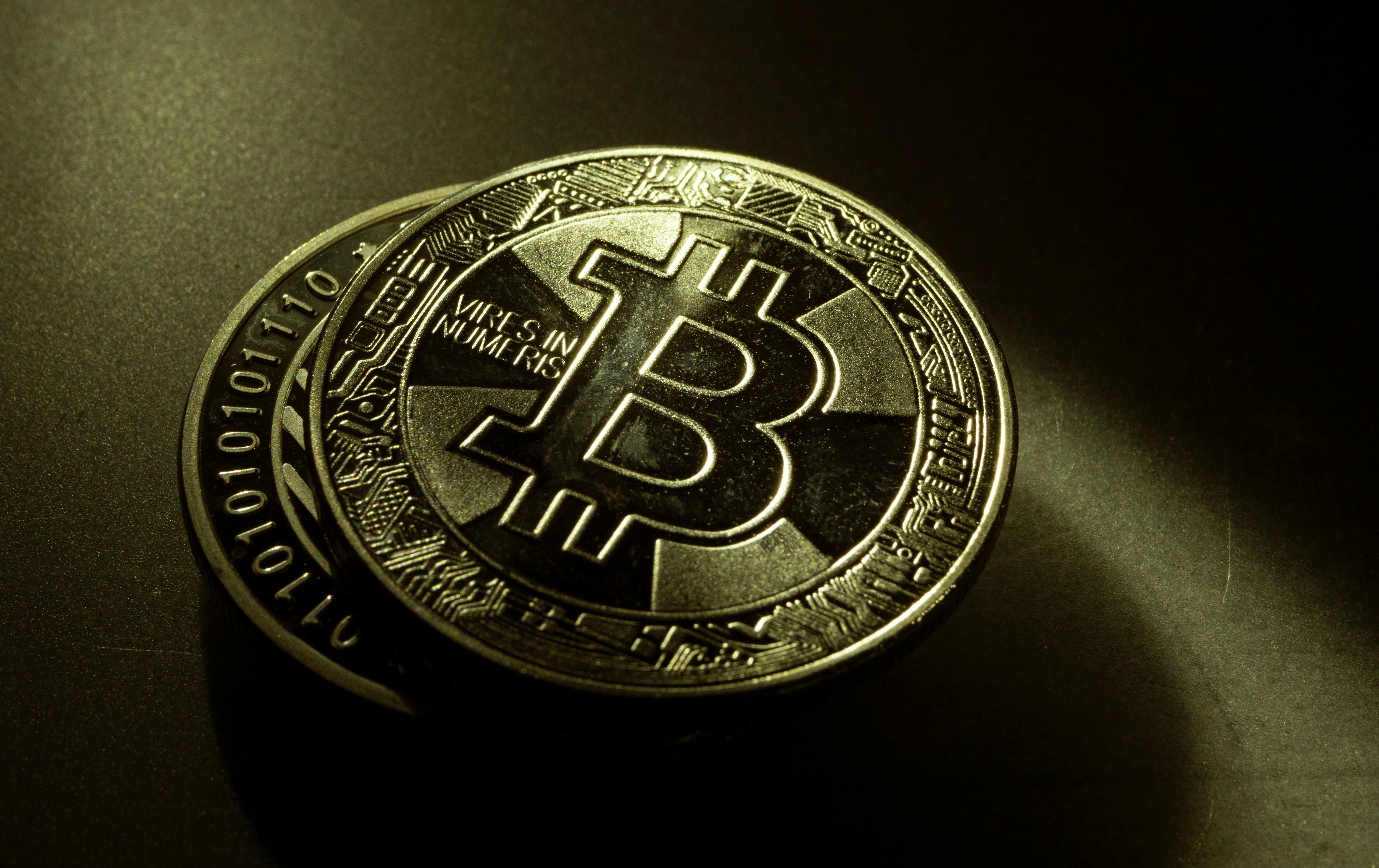 Bitcoin cryptocurrency coin close-up on dark background symbolizing digital currency investment, blockchain technology, and the global crypto market.