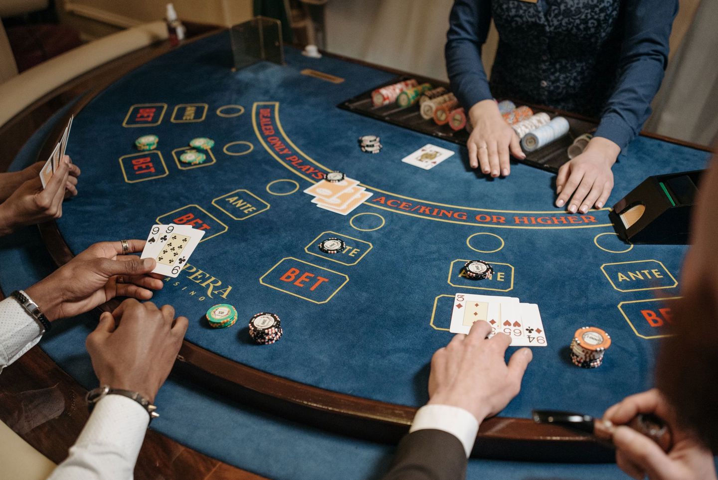 People playing a lively card game at a casino
